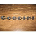 Nápis "GORDINI" - chróm